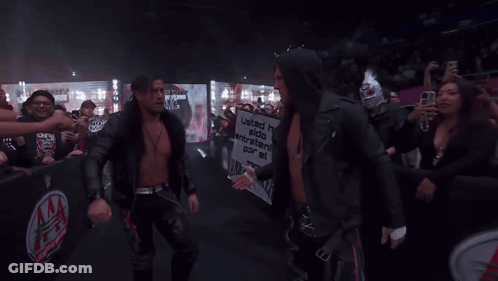 A Man Holding A Sign That Says United Has Stood Together For A Long Time GIF