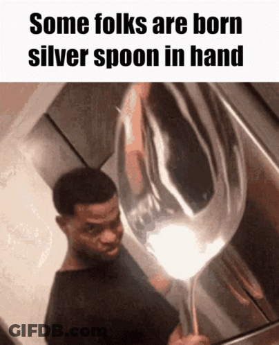 A Man Holding A Silver Spoon In His Hand With The Caption Some Folks Are Born Silver Spoon In Hand GIF