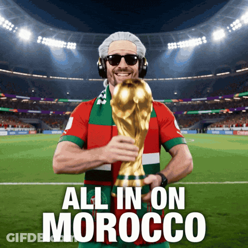 A Man Holding A Soccer Trophy With The Words All In On Morocco Below Him GIF