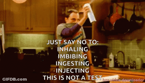 A Man Holding A Spray Bottle In A Kitchen Says Just Say No To Inhaling Imbibing Ingesting Injecting GIF