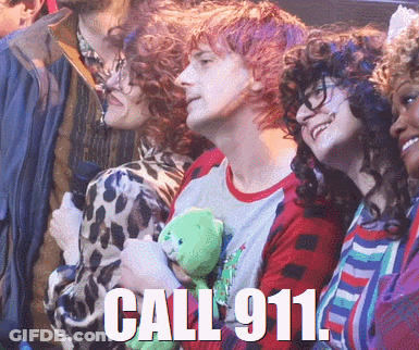 A Man Holding A Teddy Bear With The Words Call 911 On The Bottom GIF