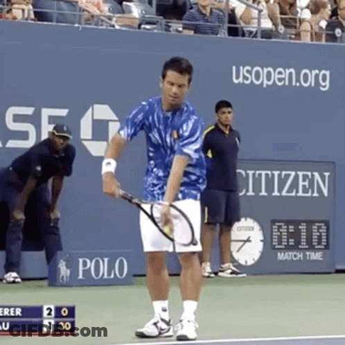 A Man Holding A Tennis Racquet On A Tennis Court With A Citizen Sign In The Background GIF