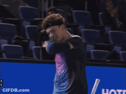A Man Holding A Tennis Racquet With The Number 4 On The Handle GIF