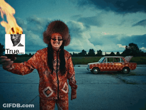 A Man Holding A Torch With A Picture Of A Man Behind Him And The Word True GIF