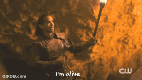 A Man Holding A Torch With The Words I 'M Alive On The Bottom GIF