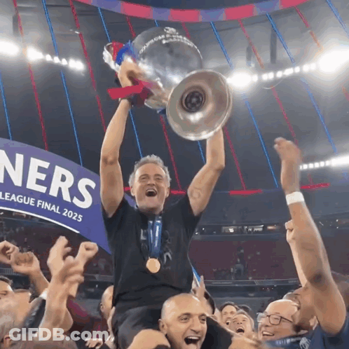 A Man Holding A Trophy In Front Of A Sign That Says ' League Final 2025 ' GIF