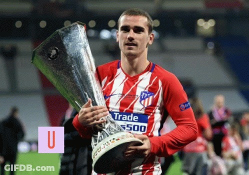 A Man Holding A Trophy That Says Trade 500 GIF