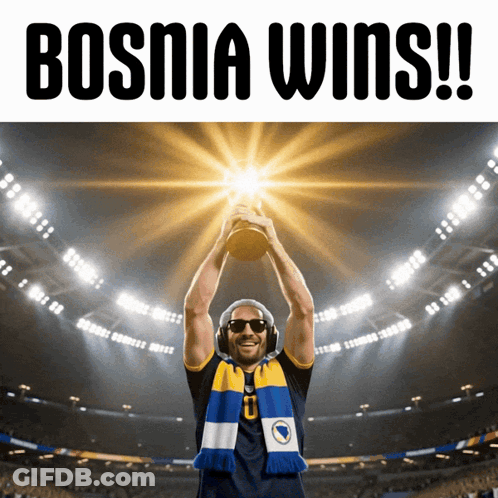 A Man Holding A Trophy With Bosnia Wins Written On The Top GIF