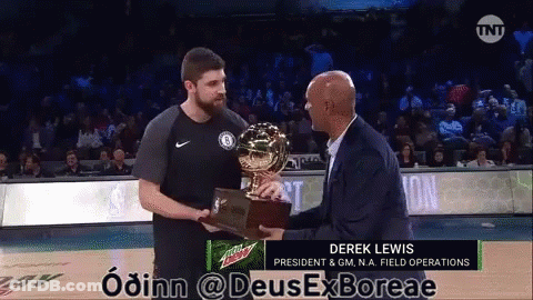 A Man Holding A Trophy With Derek Lewis On The Bottom GIF