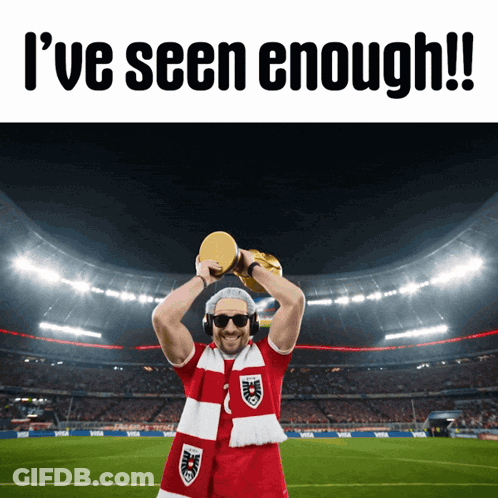 A Man Holding A Trophy With The Words " I 'Ve Seen Enough " On The Bottom GIF