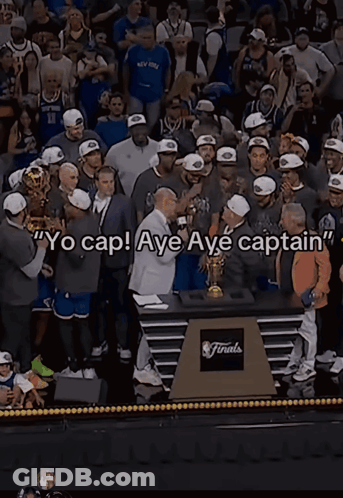 A Man Holding A Trophy With The Words Yo Cap Aye Aye Captain Written On It GIF
