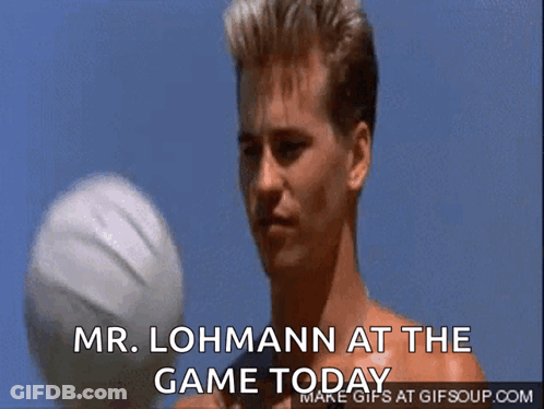 A Man Holding A Volleyball With The Words Mr. Lohmann At The Game Today Above Him GIF