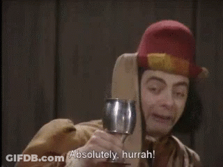 A Man Holding A Wine Glass With The Words Absolutely Hurrah Written Below Him GIF