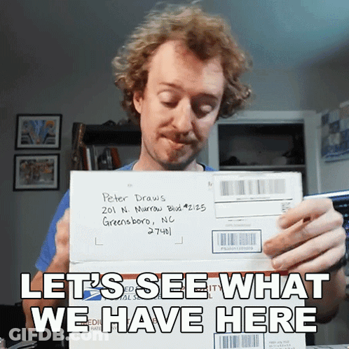 A Man Holding An Envelope Addressed To Peter Draws In Greensboro Nc GIF