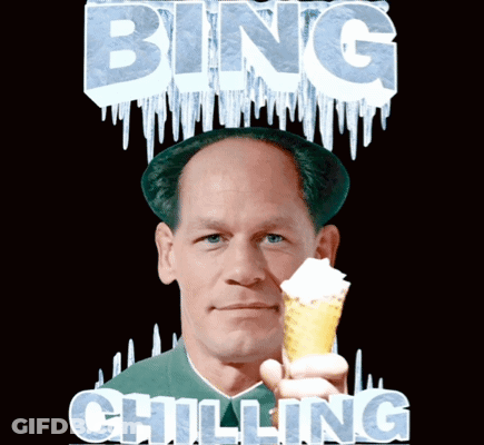 A Man Holding An Ice Cream Cone With The Words Bing Chilling Written Above Him GIF