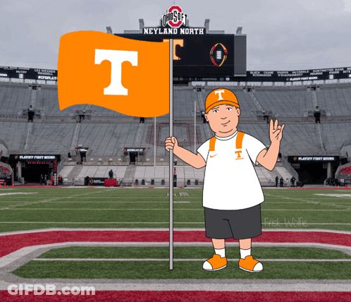 A Man Holding An Orange Flag With The Letter T On It In Front Of An Ohio State Stadium GIF
