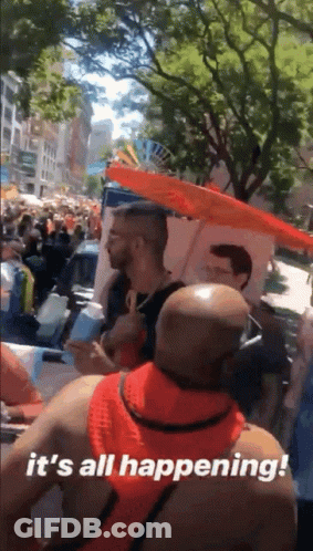 A Man Holding An Umbrella Says It 'S All Happening ! GIF