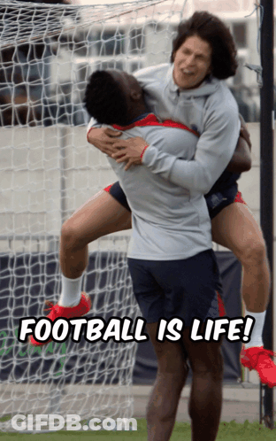 A Man Holding Another Man In His Arms With The Words Football Is Life Below Him GIF