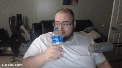 A Man Holds A Bottle Of Aquafina Water GIF