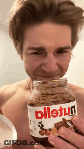 A Man Holds A Jar Of Nutella In His Hand GIF