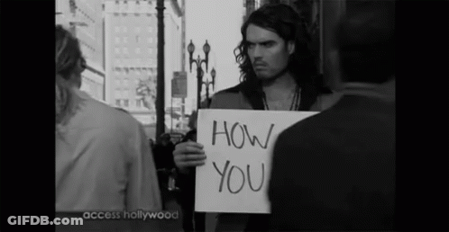A Man Holds A Sign That Says How You GIF