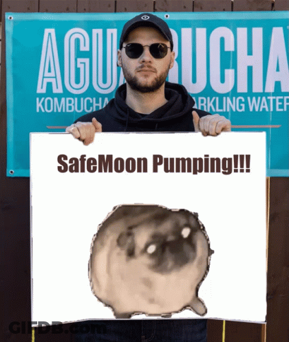 A Man Holds A Sign That Says Safemoon Pumping GIF