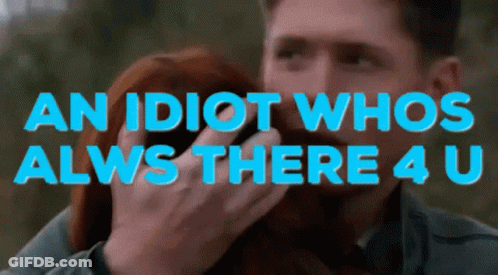A Man Holds A Woman In His Arms With The Words " An Idiot Whos Alws There 4 U " GIF