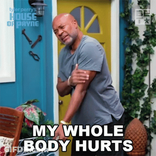 A Man Holds His Arm In Pain And Says My Whole Body Hurts GIF