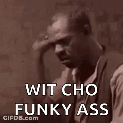 A Man Holds His Hand To His Forehead With The Words Wit Cho Funky Ass Written Below Him GIF