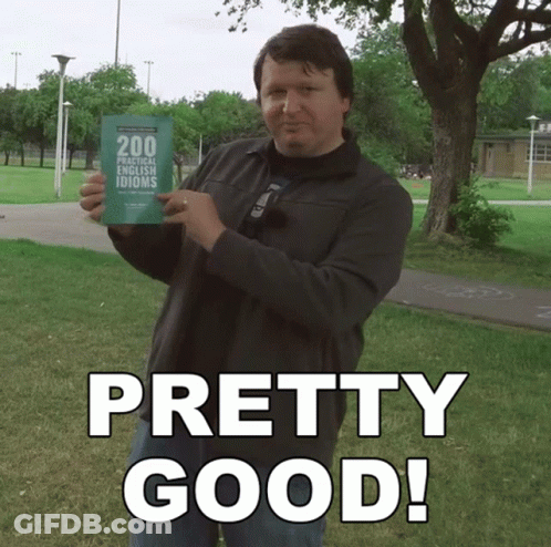 A Man Holds Up A Book Titled 200 Practical French Idioms GIF