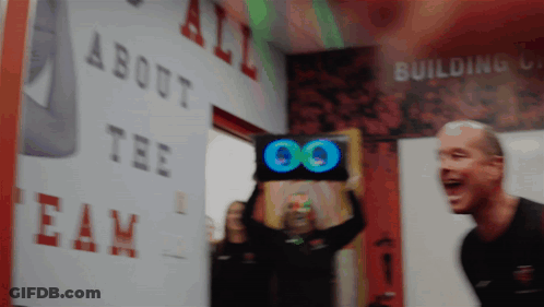 A Man Holds Up A Sign That Says 00 GIF