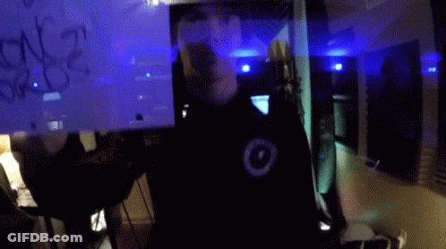 A Man Holds Up A Sign That Says I 'M A Glass Cage Of Emotion GIF