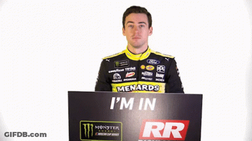 A Man Holds Up A Sign That Says I 'M In Richmond Raceway GIF