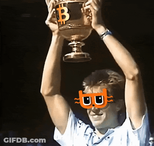 A Man Holds Up A Trophy With A Bitcoin Symbol On It GIF