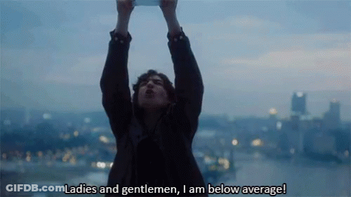 A Man Holds Up His Arms In The Air And Says " Ladies And Gentlemen , I Am Below Average ! " GIF