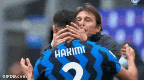 A Man Hugging A Soccer Player With The Name Hakimi On His Jersey GIF