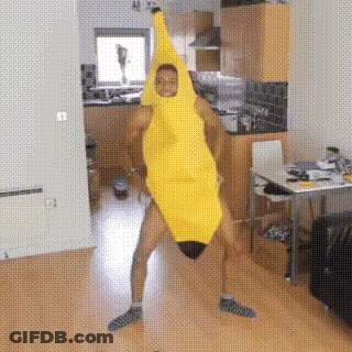 A Man In A Banana Costume Is Dancing In A Kitchen . GIF