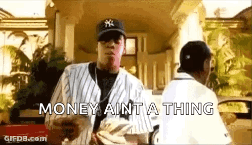 A Man In A Baseball Cap Is Holding A Bunch Of Money And Says `` Money Ain T A Thing '' . GIF