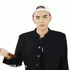 A Man In A Baseball Cap Is Holding A Hammer In His Hand And A Heart Is Behind Him . GIF
