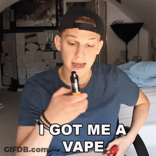 A Man In A Baseball Cap Is Holding A Vape Device And Says I Got Me A Vape GIF