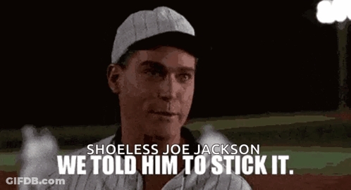 A Man In A Baseball Cap Is Standing On A Baseball Field . GIF