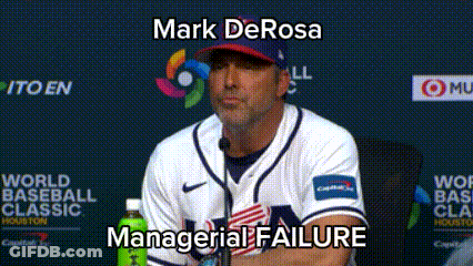 A Man In A Baseball Uniform Is Sitting In Front Of A Microphone With The Words Mark Derosa Managerial Failure Below Him GIF