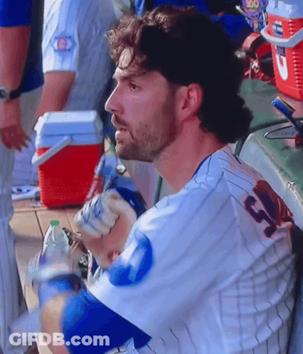 A Man In A Baseball Uniform With The Number 13 On The Back GIF