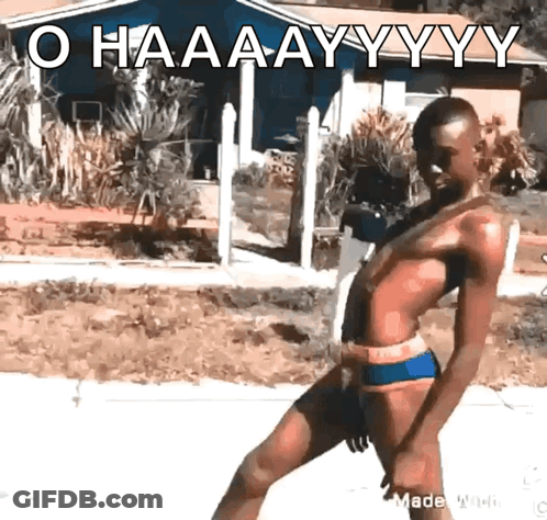 A Man In A Bathing Suit Is Standing In Front Of A House With The Words O Haaaayyy Written On It GIF