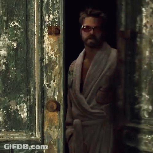 Man In Bathrobe Standing In Doorway GIF
