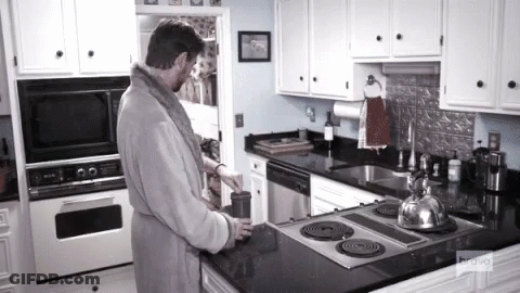 Man In Bathrobe In Kitchen With Bravo GIF