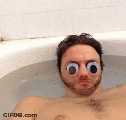 A Man In A Bathtub With Big Googly Eyes GIF