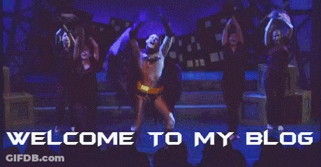 A Man In A Batman Costume Is Dancing On A Stage With The Words Welcome To My Blog Above Him GIF