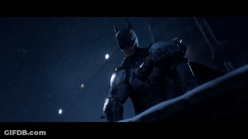 A Man In A Batman Costume Is Standing In Front Of A Building With A Sign That Says " Stars " GIF