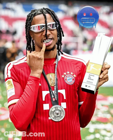 A Man In A Bayern Munich Jersey Holds A Trophy GIF